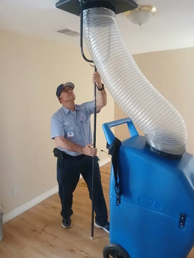 HVAC Installation technician using HEPA equipment in Brick